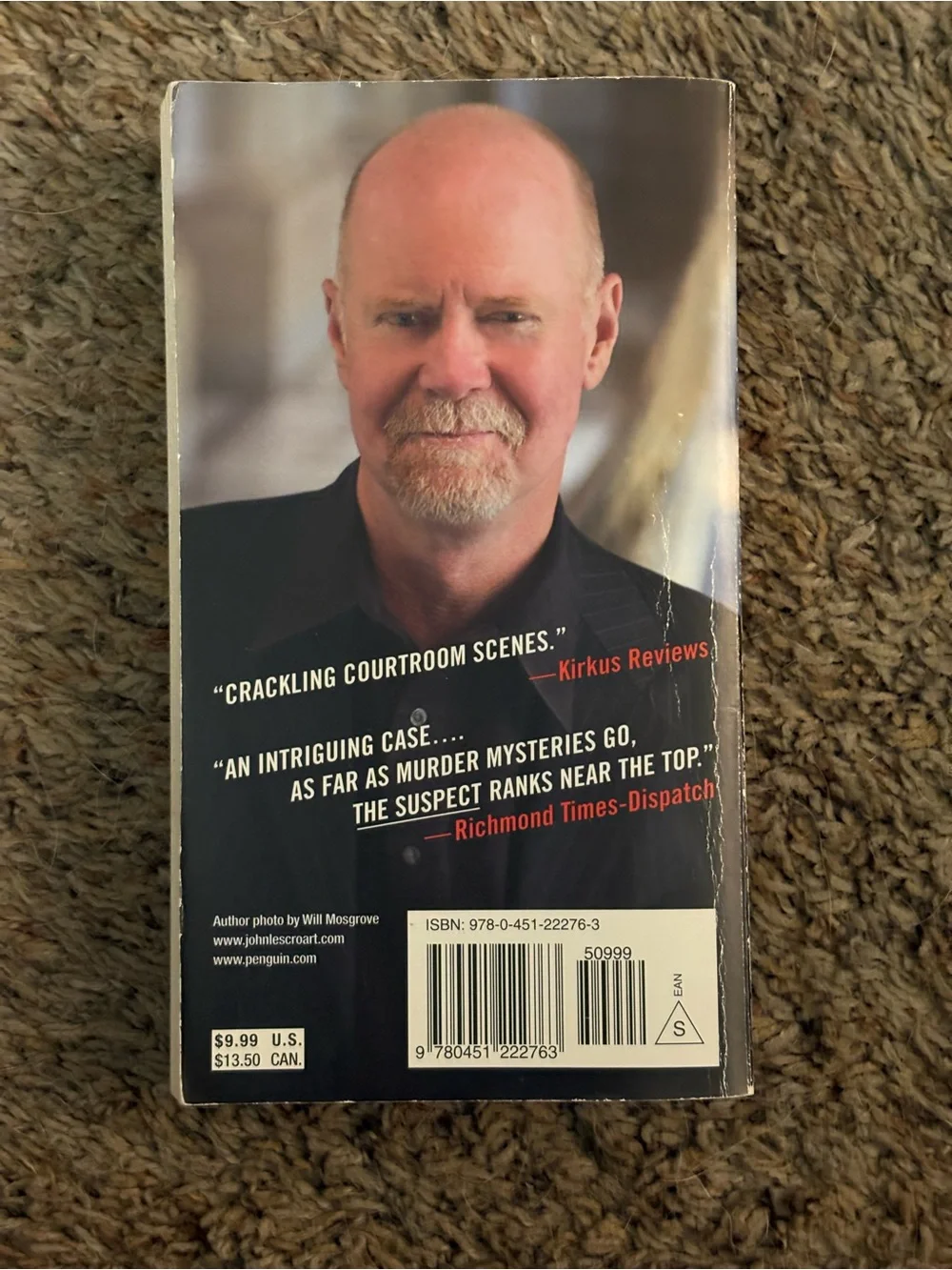 Heavy Weather by Bruce Sterling - The Suspect by John Lescroart. GUC.